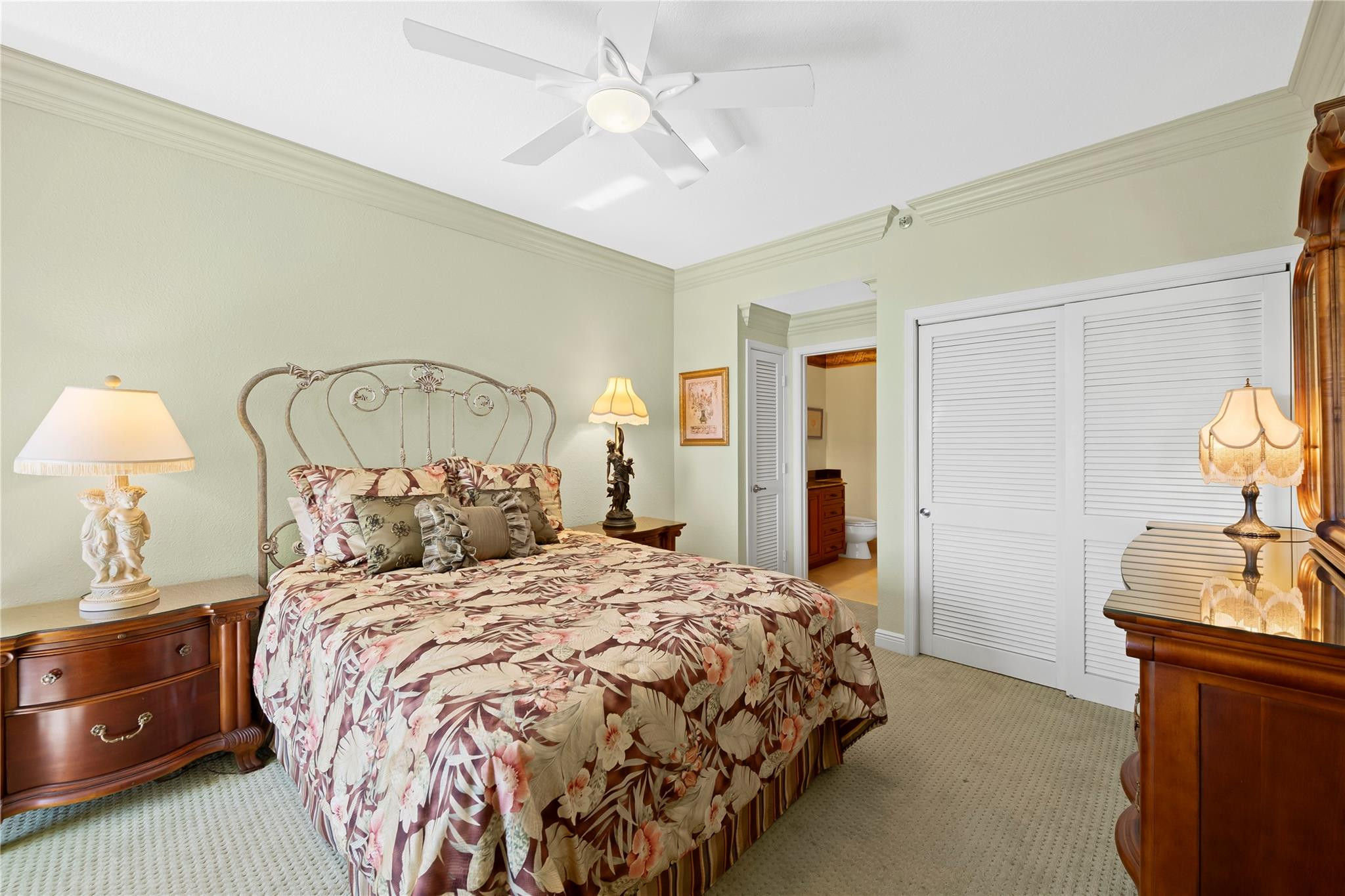 17031 Boca Club Boulevard, Unit 85A Boca Raton, FL 33487 - Photo 24 of 49 a bedroom with a bed and a chandelier