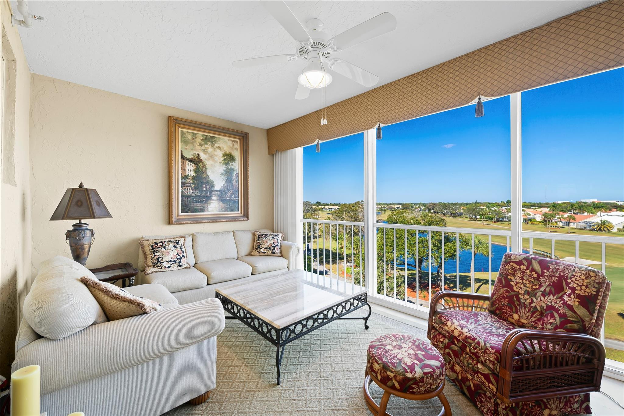 17031 Boca Club Boulevard, Unit 85A Boca Raton, FL 33487 - Photo 25 of 49 a living room with furniture ceiling fan and a rug