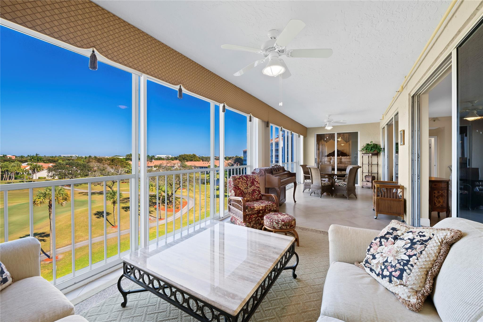 17031 Boca Club Boulevard, Unit 85A Boca Raton, FL 33487 - Photo 26 of 49 a living room with furniture floor to ceiling window and floor to ceiling window