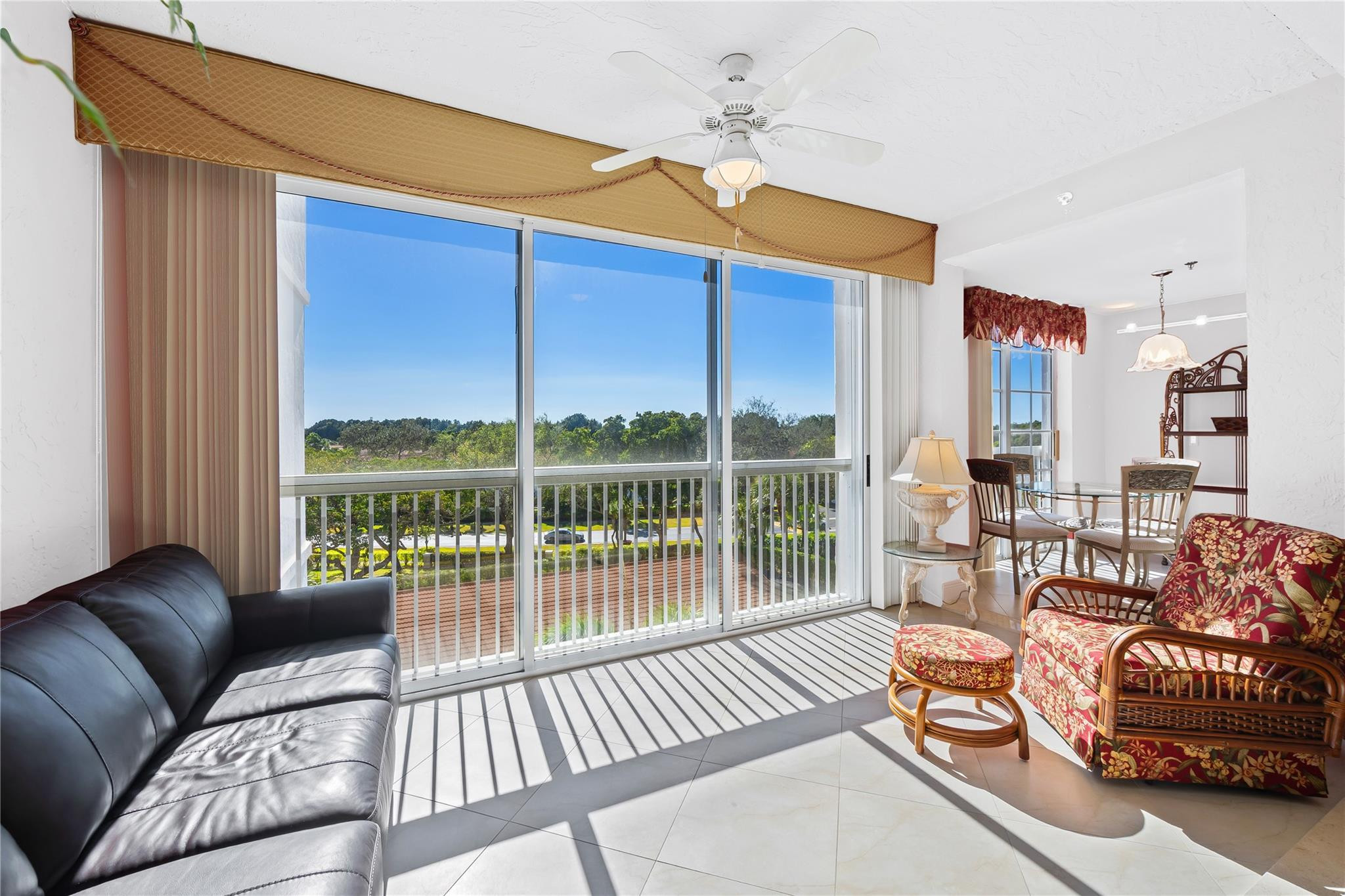 17031 Boca Club Boulevard, Unit 85A Boca Raton, FL 33487 - Photo 34 of 49 a balcony with furniture and a chandelier