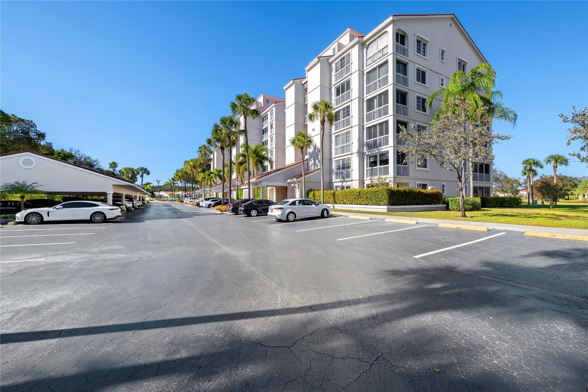 17031 Boca Club Boulevard, Unit 85A Boca Raton, FL 33487 - Photo 42 of 49 a view of a street with a building in the background