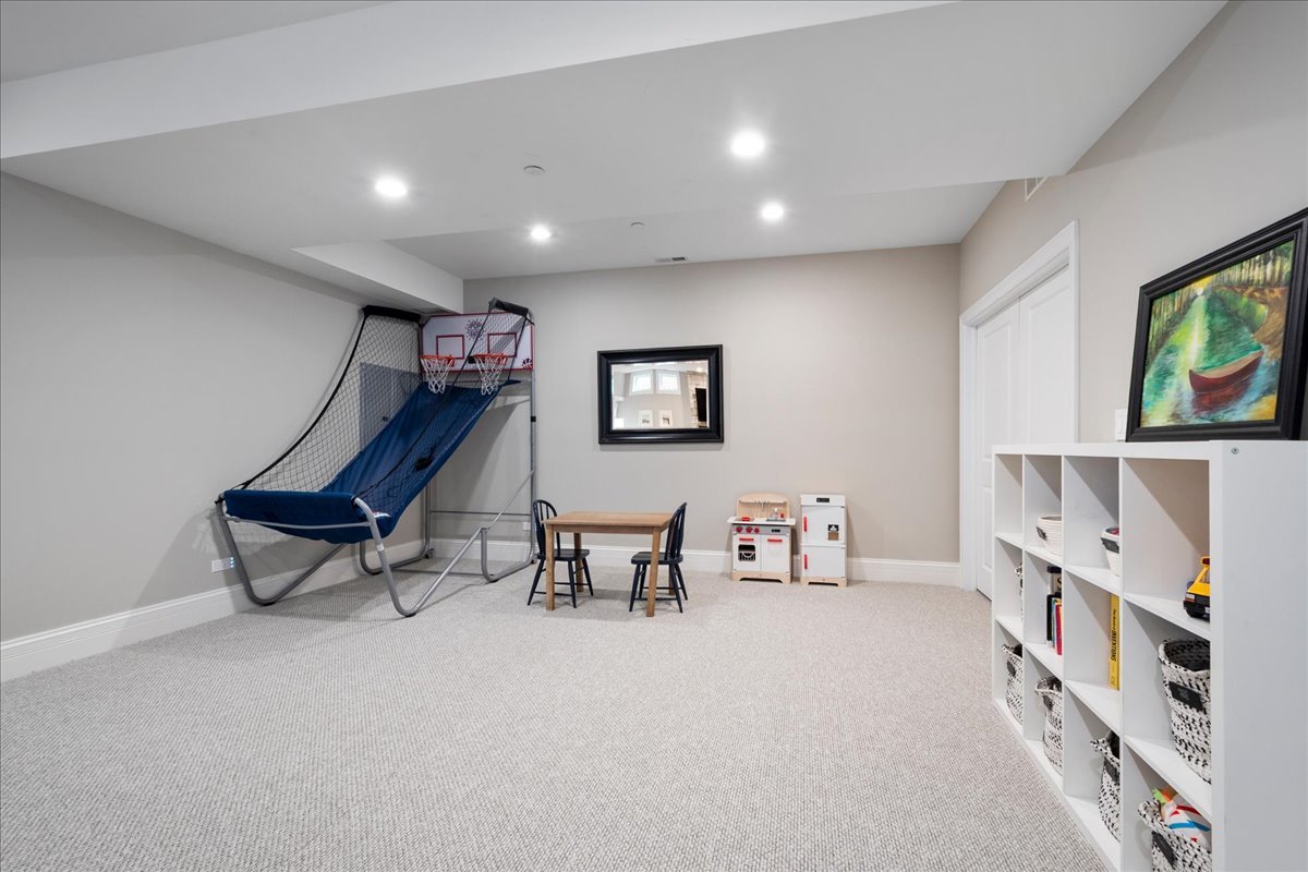 2921 Simpson Street Evanston, IL 60201 - Photo 28 of 41 a living room with furniture and a bookshelf