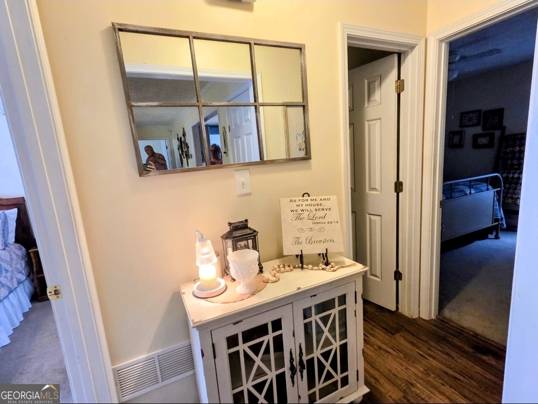 21 Baskin Heights Path Temple, GA 30179 - Photo 22 of 44 a view of a bathroom with a sink and wooden cabinet