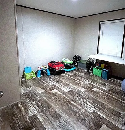 a room with toys and wooden floor