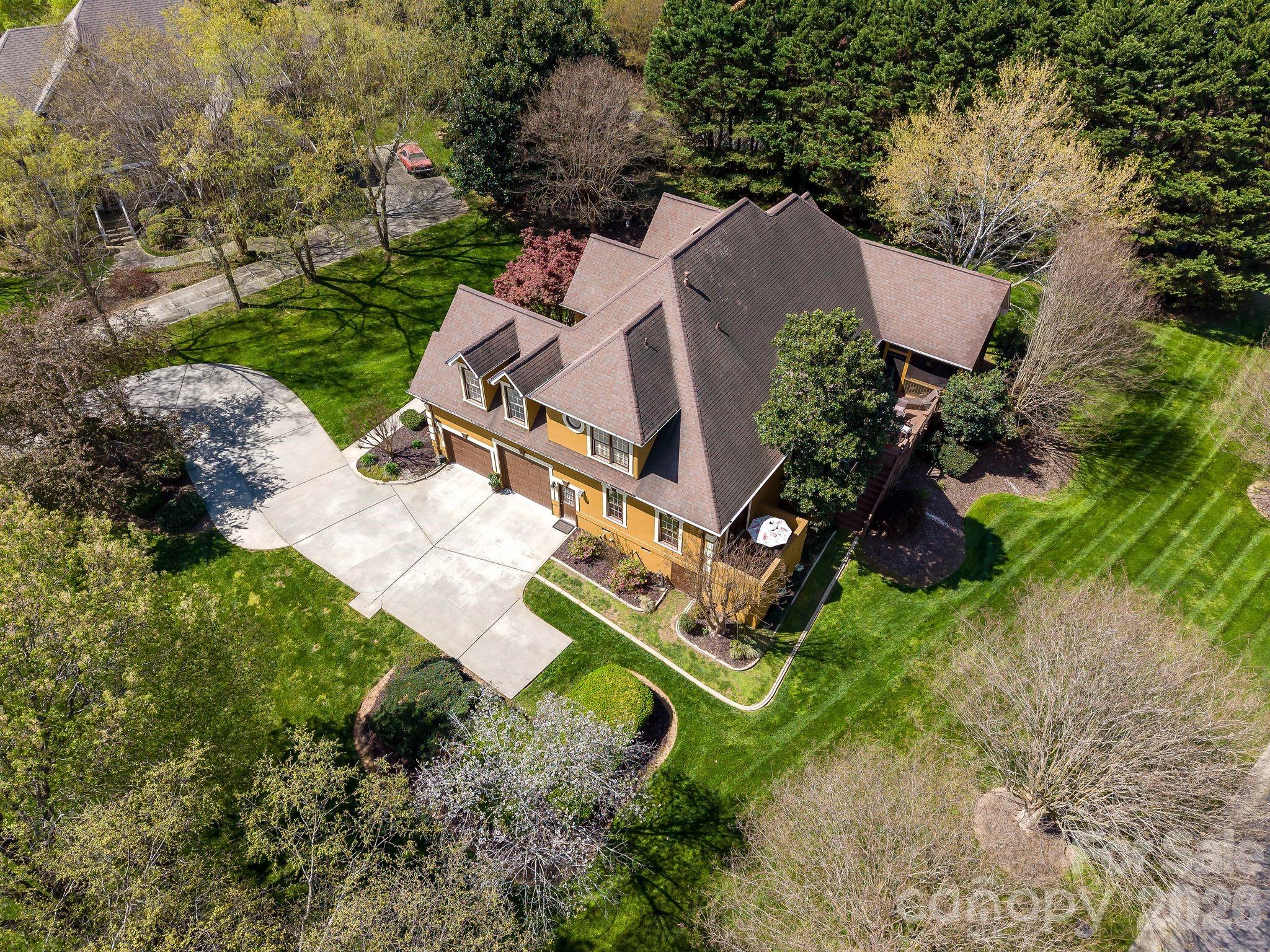 3530 Cardiff Lane Matthews, NC 28104 - Photo 36 of 39 an aerial view of a house with a yard and outdoor seating