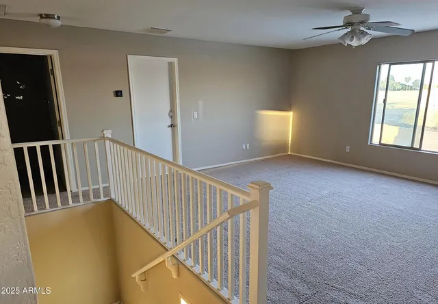 a view of a hallway with windows