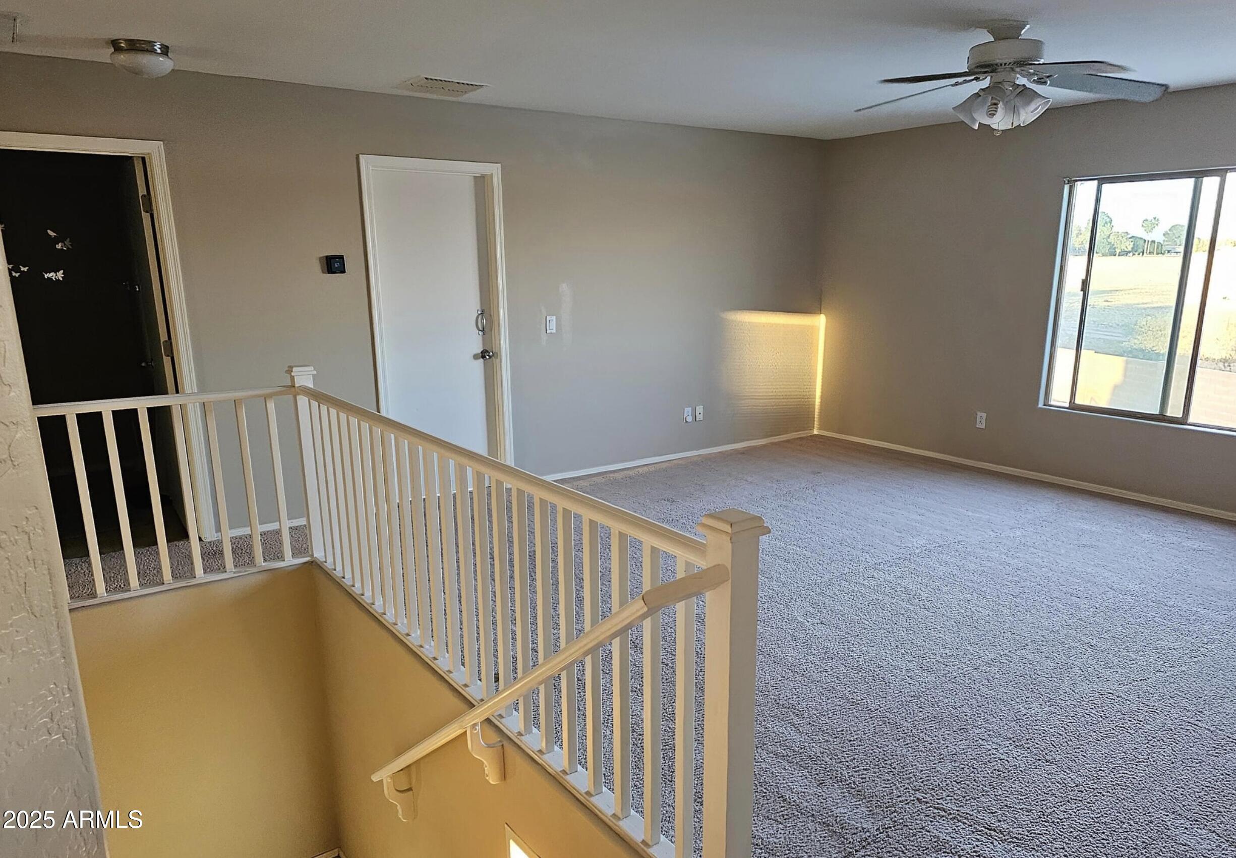 139 North Carter Ranch Road Coolidge, AZ 85128 - Photo 13 of 28 a view of a hallway with windows