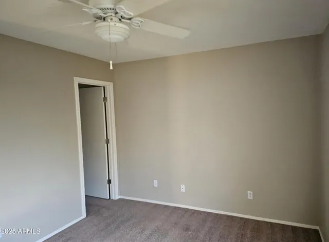 an empty room with a view of a bathroom