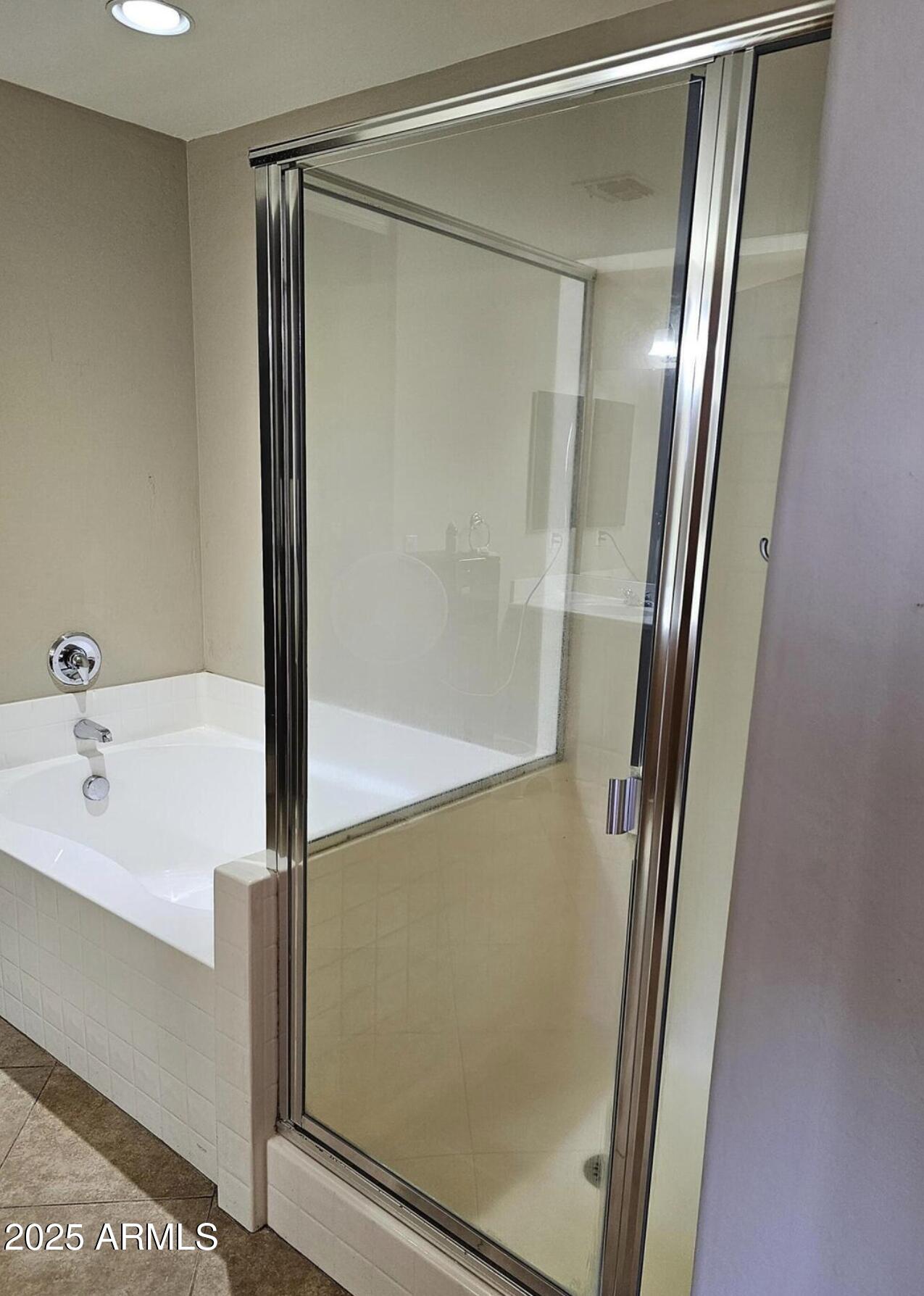 139 North Carter Ranch Road Coolidge, AZ 85128 - Photo 24 of 28 a bathroom with a bathtub and a shower