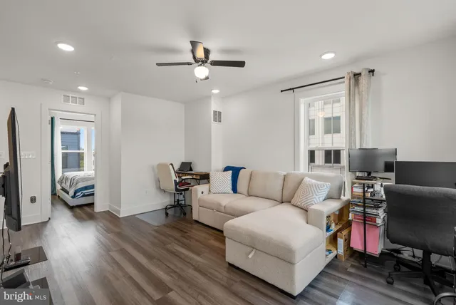 a bathroom with a sink a toilet a shower and a mirror