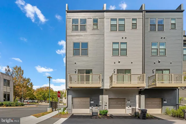 aerial view of a brick building next to a yard