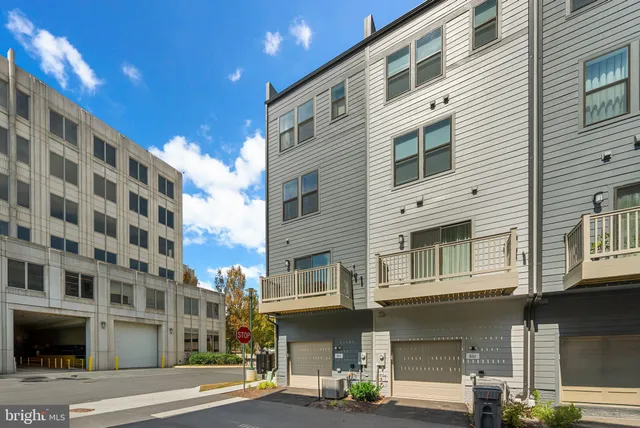 an aerial view of a house with swimming pool and a yard