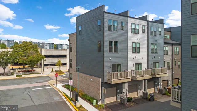 a roof deck with table and chairs