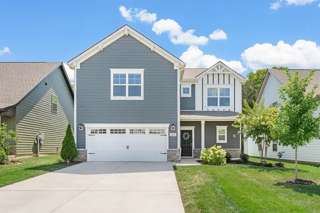 a kitchen with kitchen island a sink stove and refrigerator