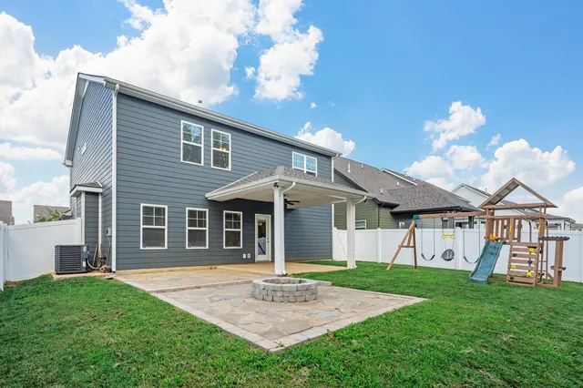 a kitchen with stainless steel appliances granite countertop a sink and stove top oven
