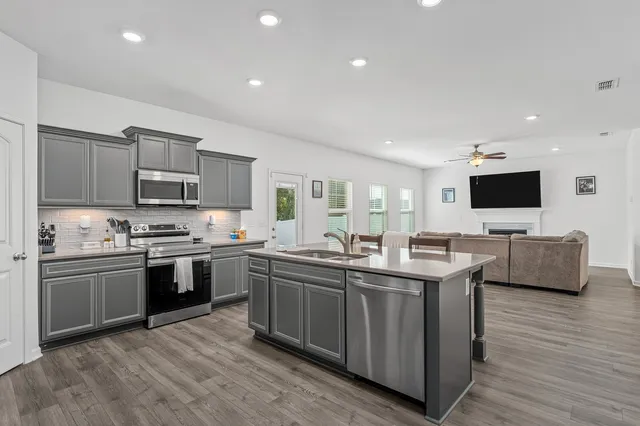 a bedroom with a bed and chair