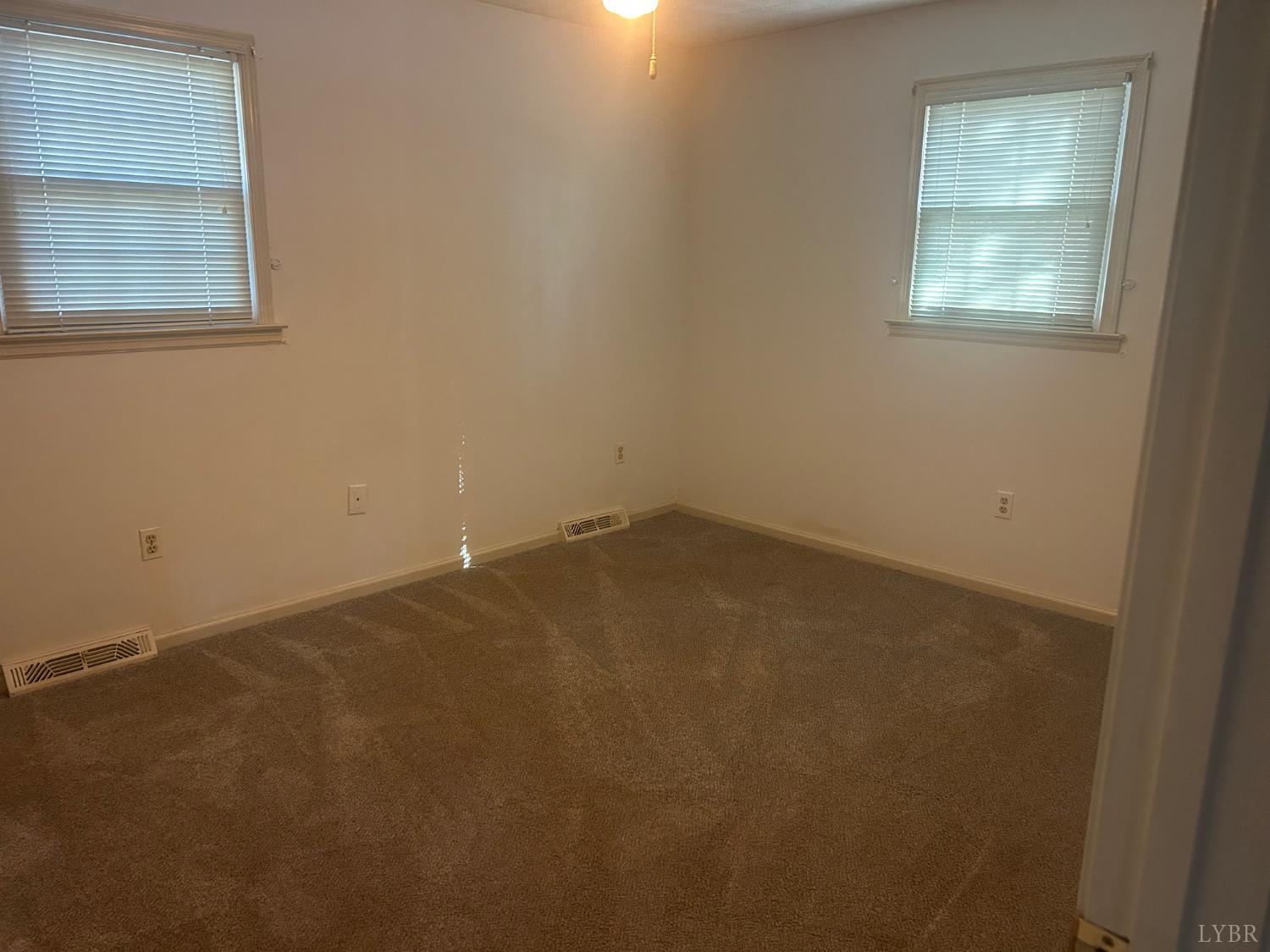 327 Dixie Airport Road Madison Heights, VA 24572 - Photo 31 of 31 an empty room with a window