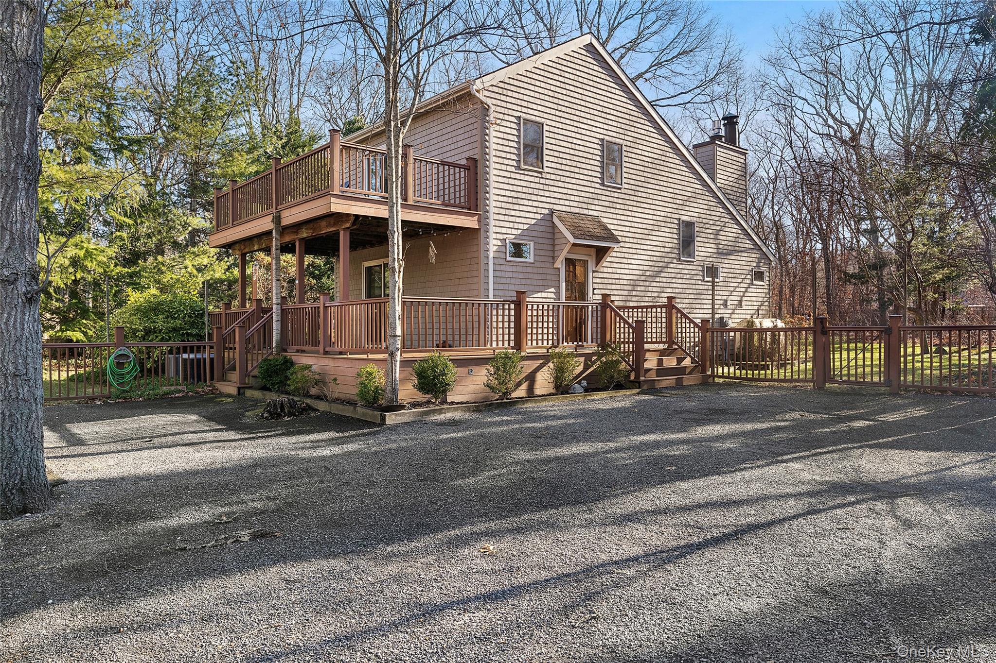 364 Three Mile Harbor Road East Hampton, NY 11937 - Photo 3 of 18 a front view of a house with a yard