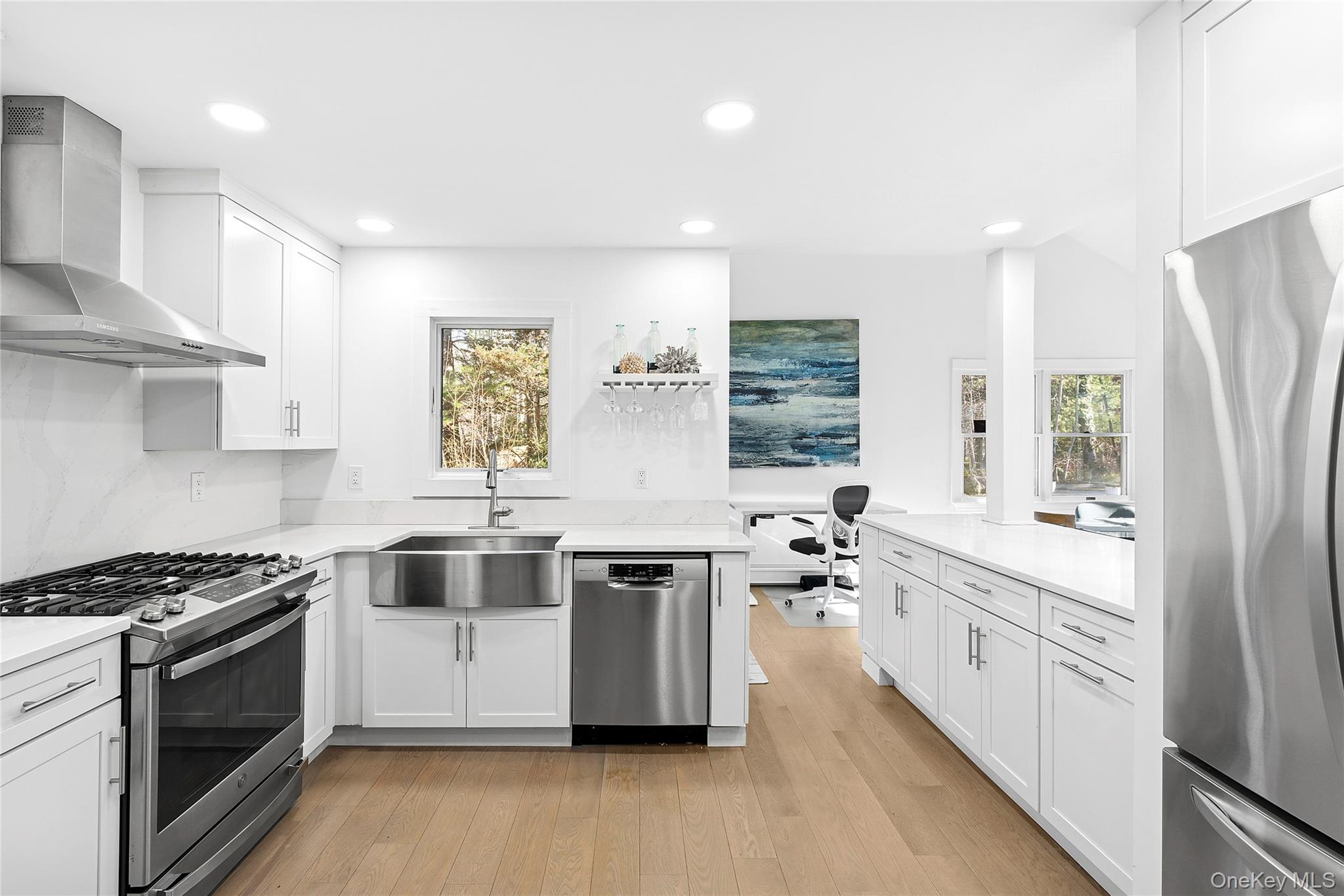 364 Three Mile Harbor Road East Hampton, NY 11937 - Photo 5 of 18 a kitchen with stainless steel appliances a stove a sink and a refrigerator