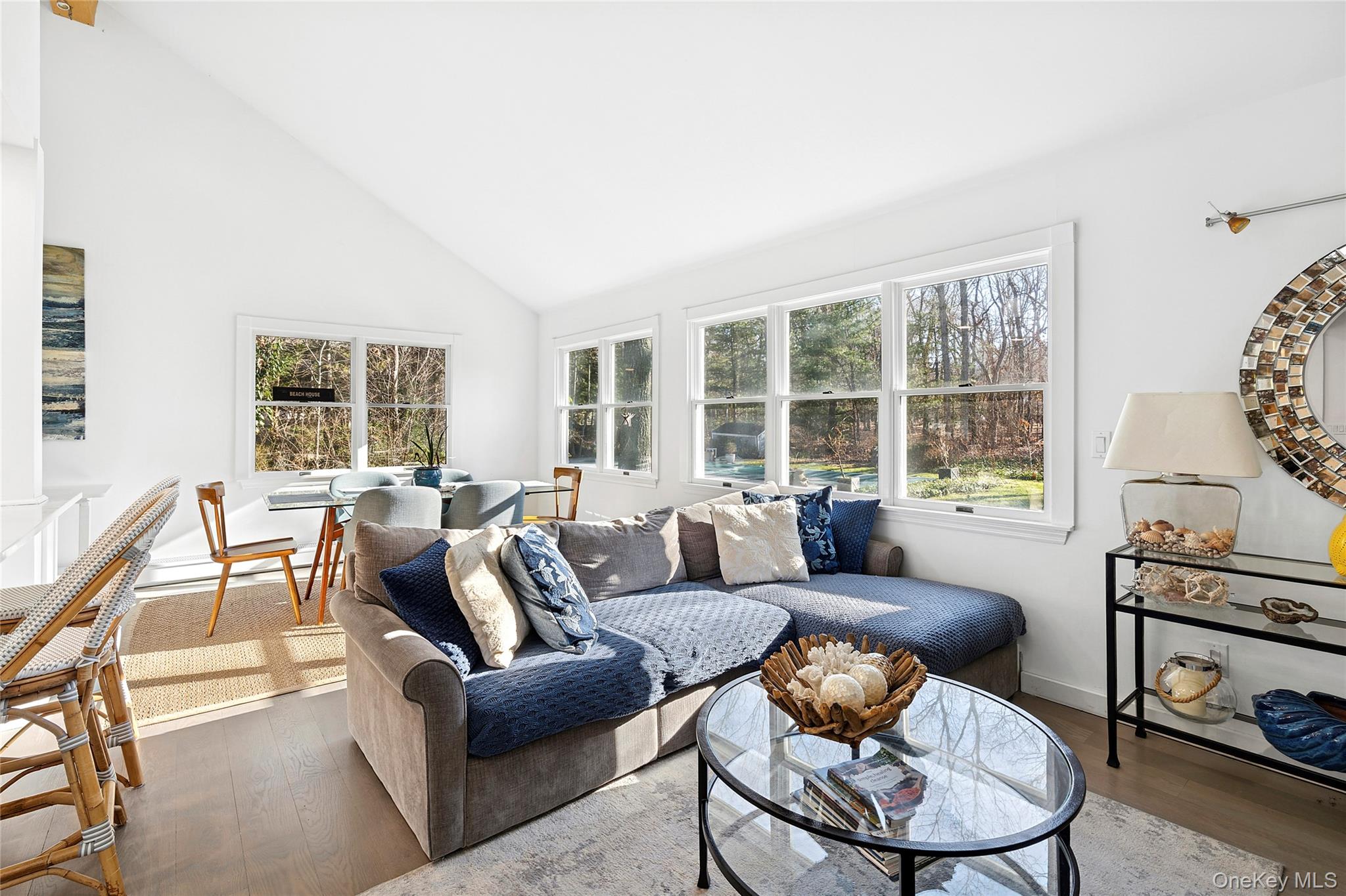 364 Three Mile Harbor Road East Hampton, NY 11937 - Photo 7 of 18 a living room with furniture and a floor to ceiling window