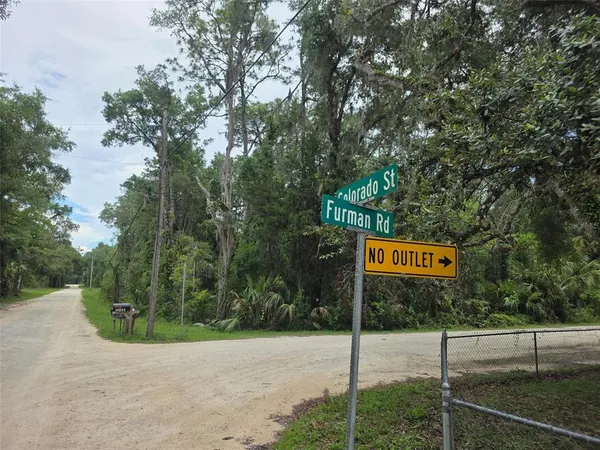 a sign that is on the side of a road