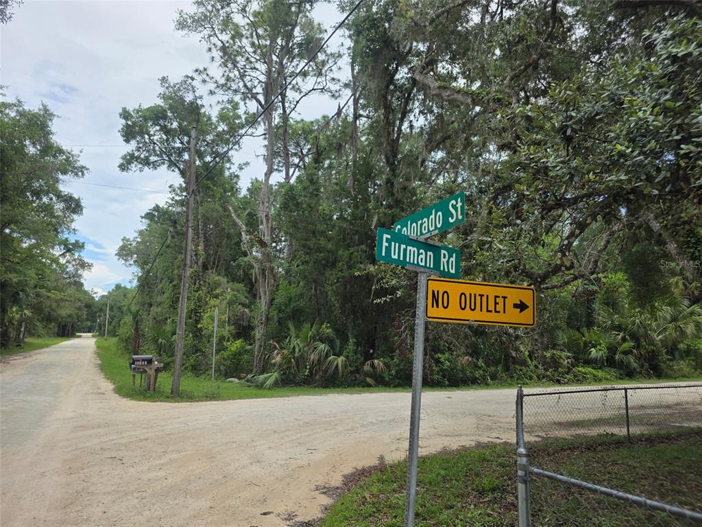 a sign that is on the side of a road