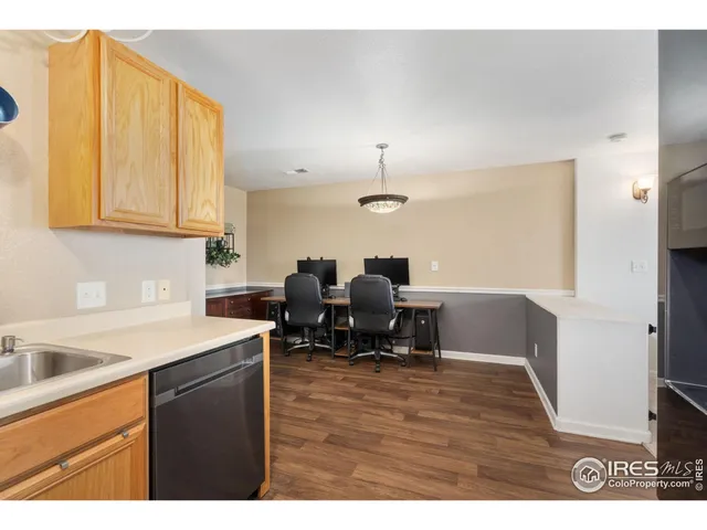 a kitchen with sink and cabinets