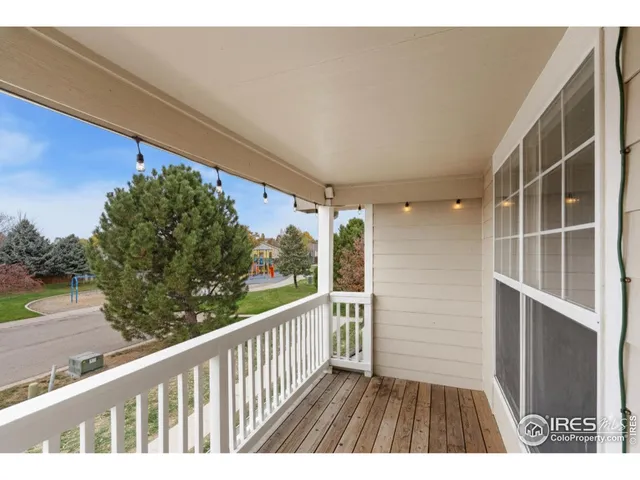 a view of balcony with wooden floor