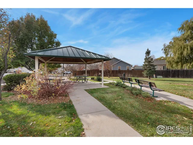 a view of a backyard with sitting area