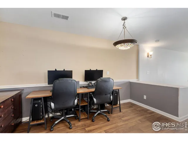 a view of a workspace with furniture