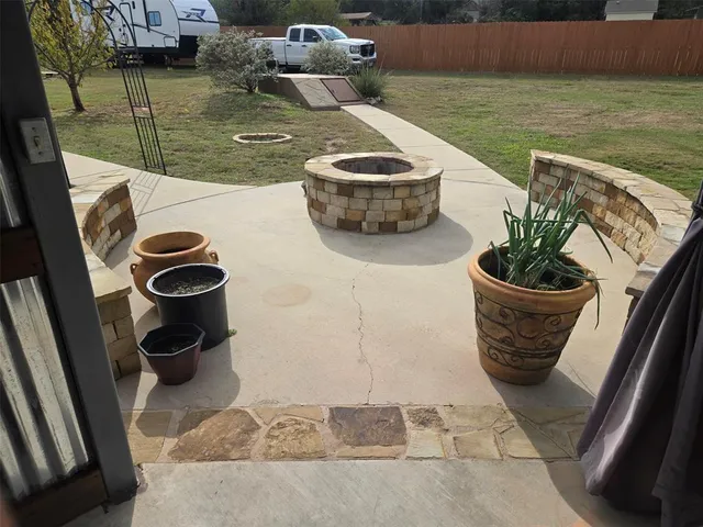 a view of yard with swimming pool and trees