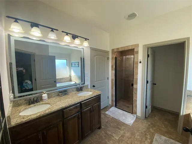 a bedroom with a bed and a walk in closet