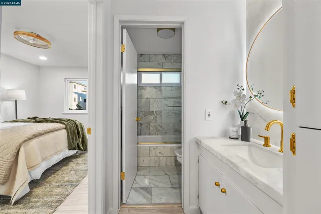 a bedroom with a bed and a mirror