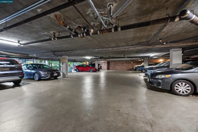 a view of parking garage with cars