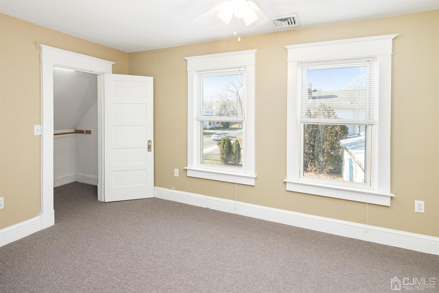 618 Ridge Road Monmouth Junction, NJ 08852 - Photo 11 of 18 a view of an empty room with window and closet area