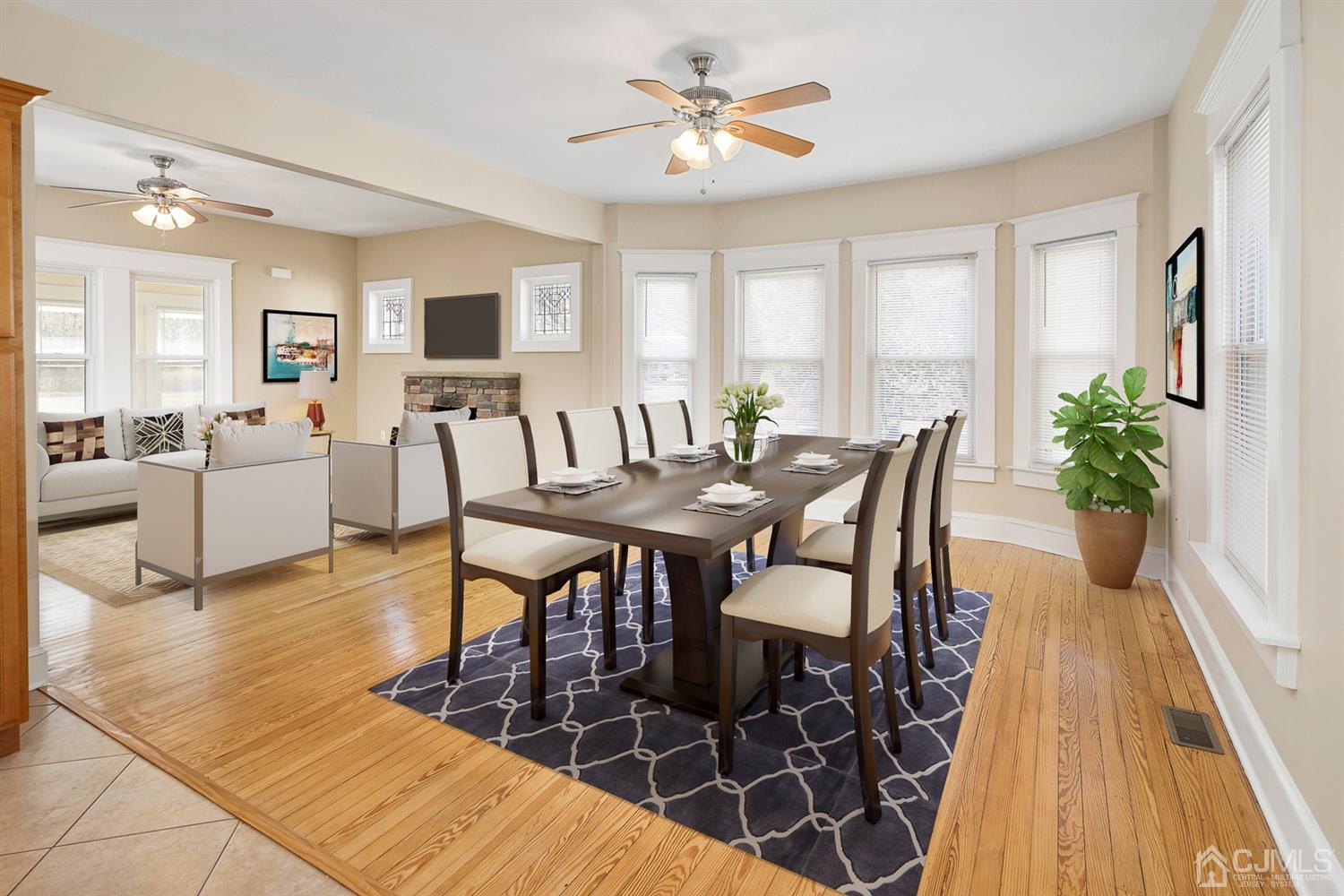 618 Ridge Road Monmouth Junction, NJ 08852 - Photo 4 of 18 a view of a dining room with furniture and wooden floor