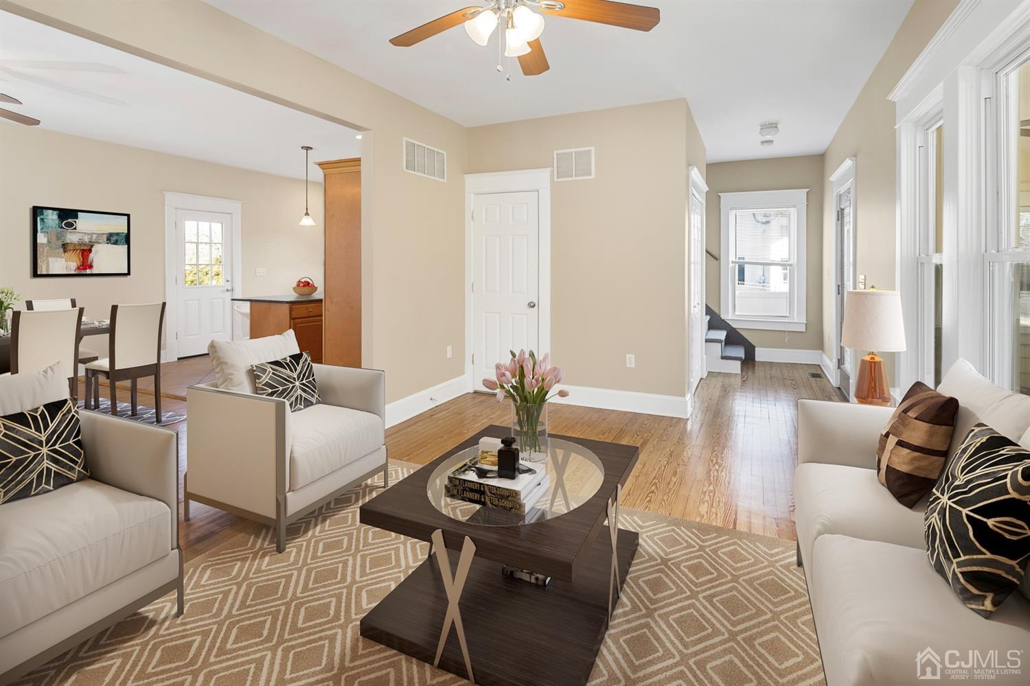 618 Ridge Road Monmouth Junction, NJ 08852 - Photo 5 of 18 a living room with furniture and a chandelier
