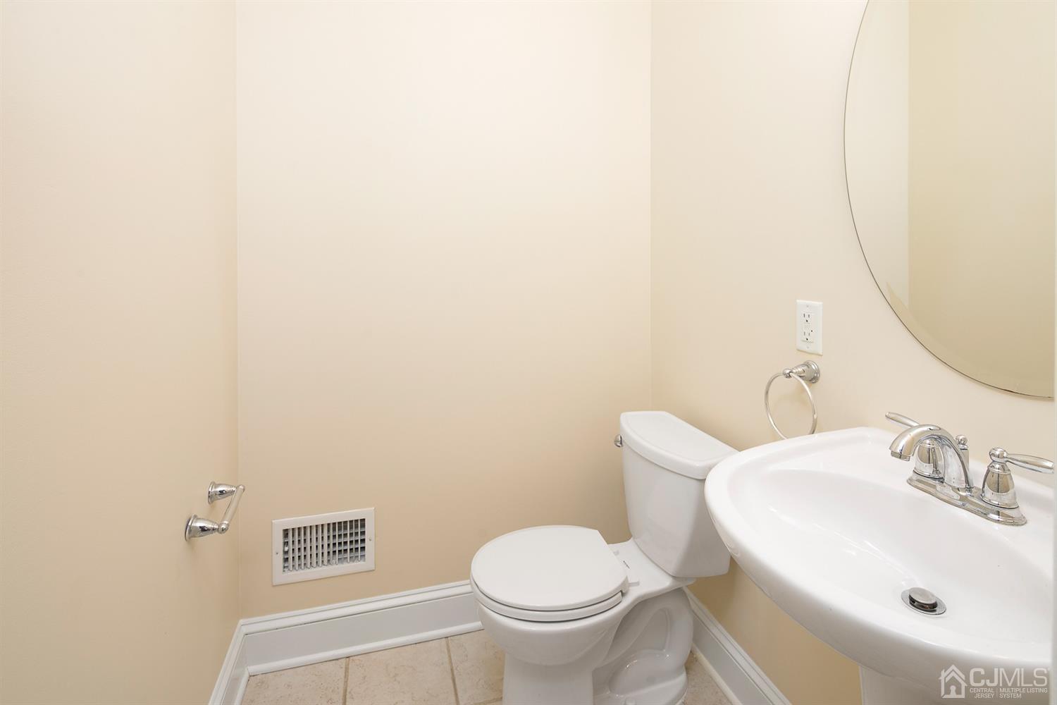 618 Ridge Road Monmouth Junction, NJ 08852 - Photo 7 of 18 a bathroom with a sink and a toilet
