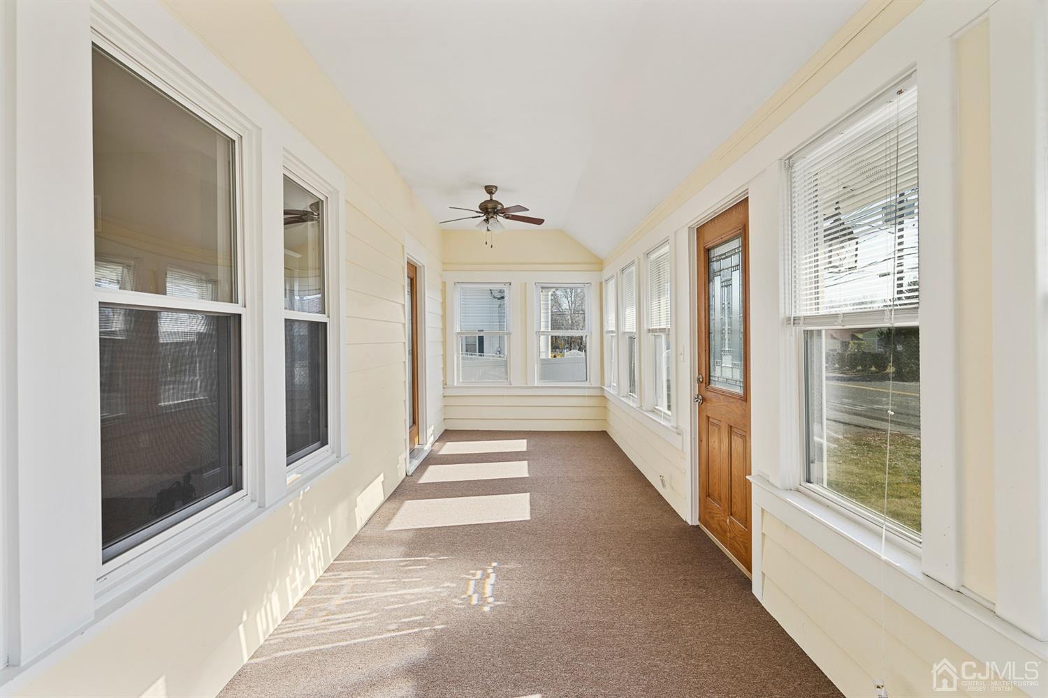 618 Ridge Road Monmouth Junction, NJ 08852 - Photo 8 of 18 a view of a hallway with windows and brick walls