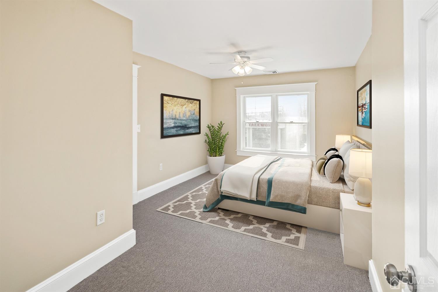 618 Ridge Road Monmouth Junction, NJ 08852 - Photo 9 of 18 a bedroom with a bed and a window