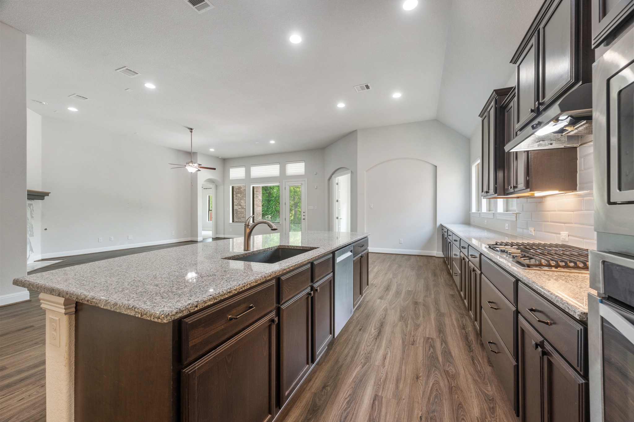 2709 Steece Way Leander, TX 78641 - Photo 19 of 39 a kitchen with granite countertop a sink stove and cabinets