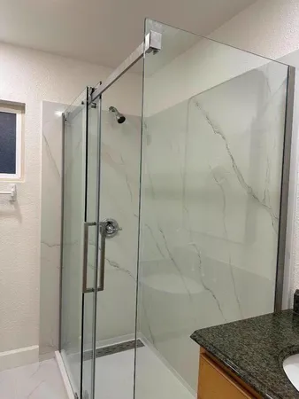 a bathroom with a shower and a shower
