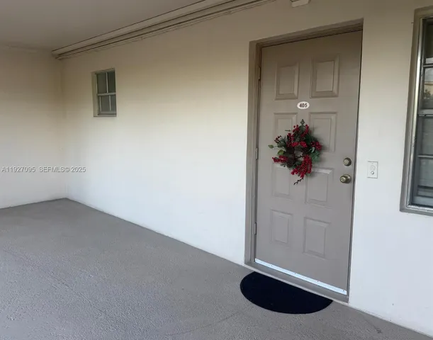 a kitchen with stainless steel appliances granite countertop a refrigerator and a stove