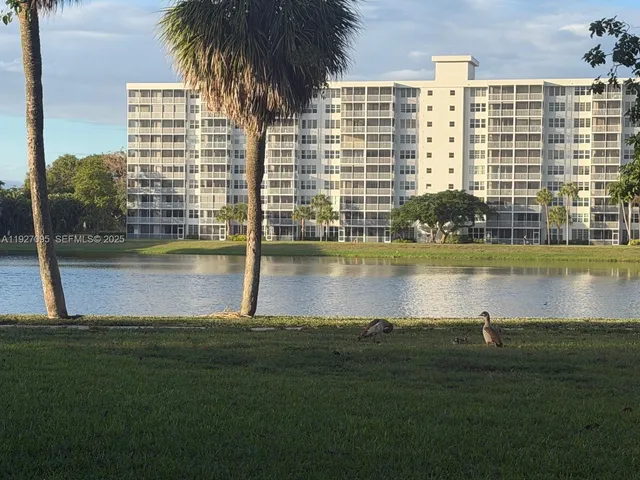 a view of a lake with a house and trees
