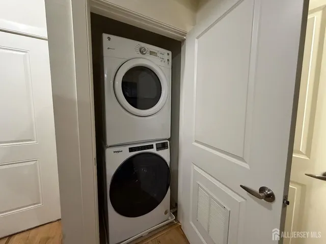 a view of a hallway with washer and dryer
