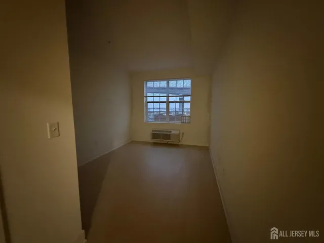 a view of an empty room and window