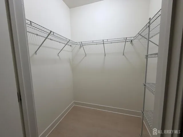 a view of a room with racks on the wall