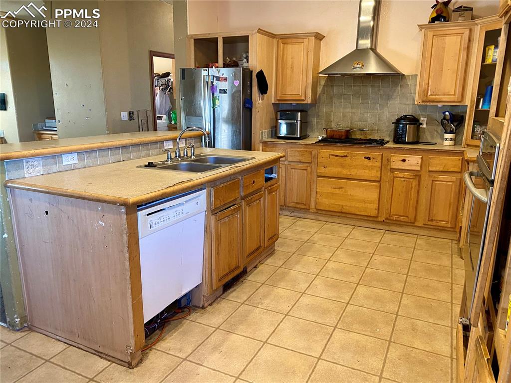 3650 Sengbeil Road Yoder, CO 80864 - Photo 8 of 33 a kitchen with stainless steel appliances a sink stove and cabinets