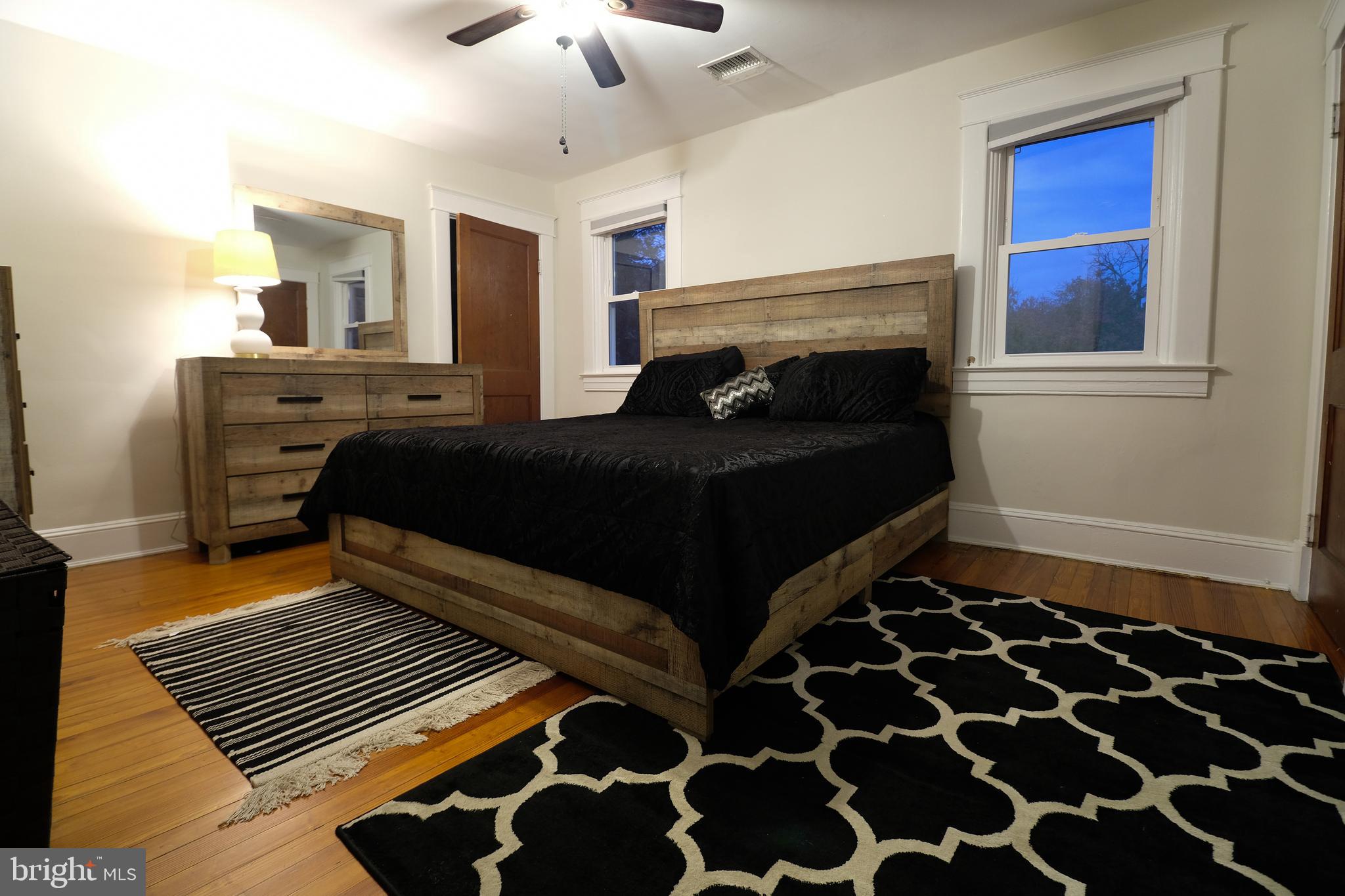 905 Woodsdale Road Catonsville, MD 21228 - Photo 11 of 23 a bedroom with a bed and a window