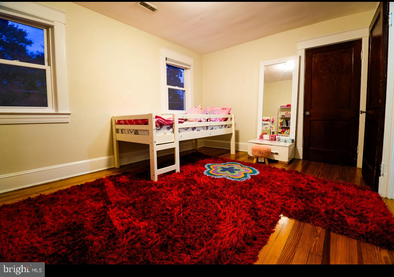 905 Woodsdale Road Catonsville, MD 21228 - Photo 14 of 23 a bedroom with a bed and a dresser